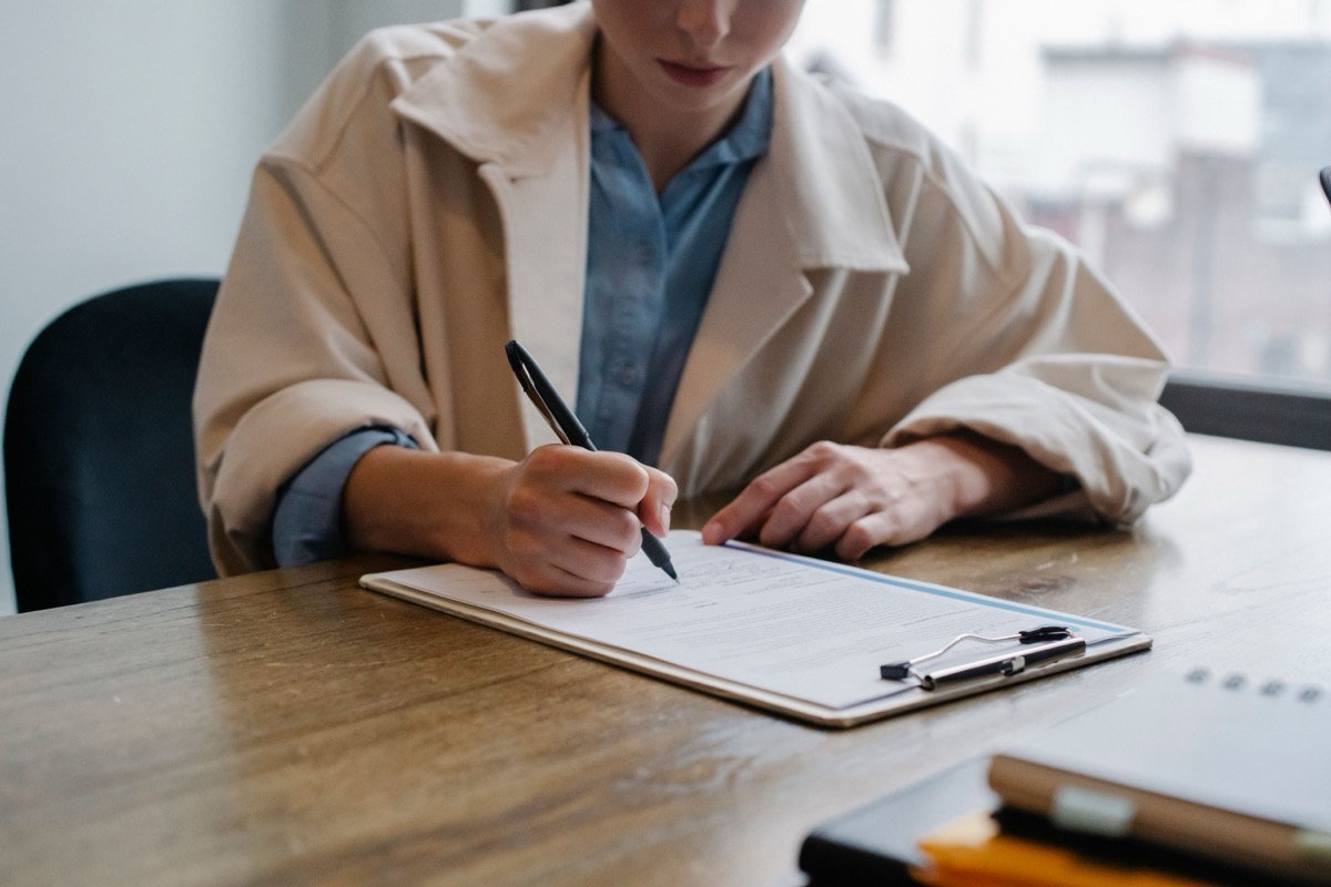 Therapist signing paperwork to leave insurance panel